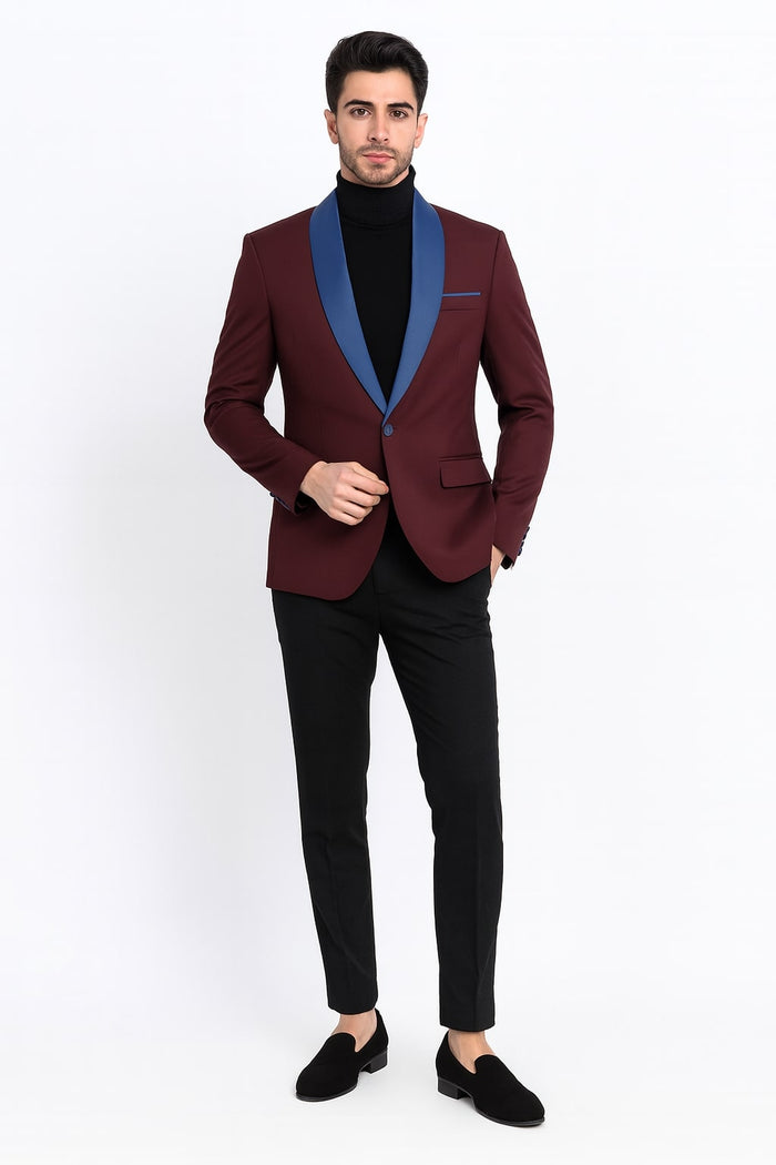 Men's burgundy tuxedo jacket with blue satin shawl lapel. Tailored fit, single-button closure, and chest pocket. Blue satin sleeve accents.

