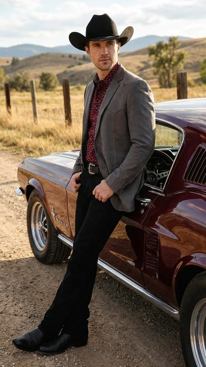 Men’s brown western faux suede blazer features a tailored fit with a notch lapel, two front pockets, and a smooth textured finish. The color is a rich brown, enhancing its western style.