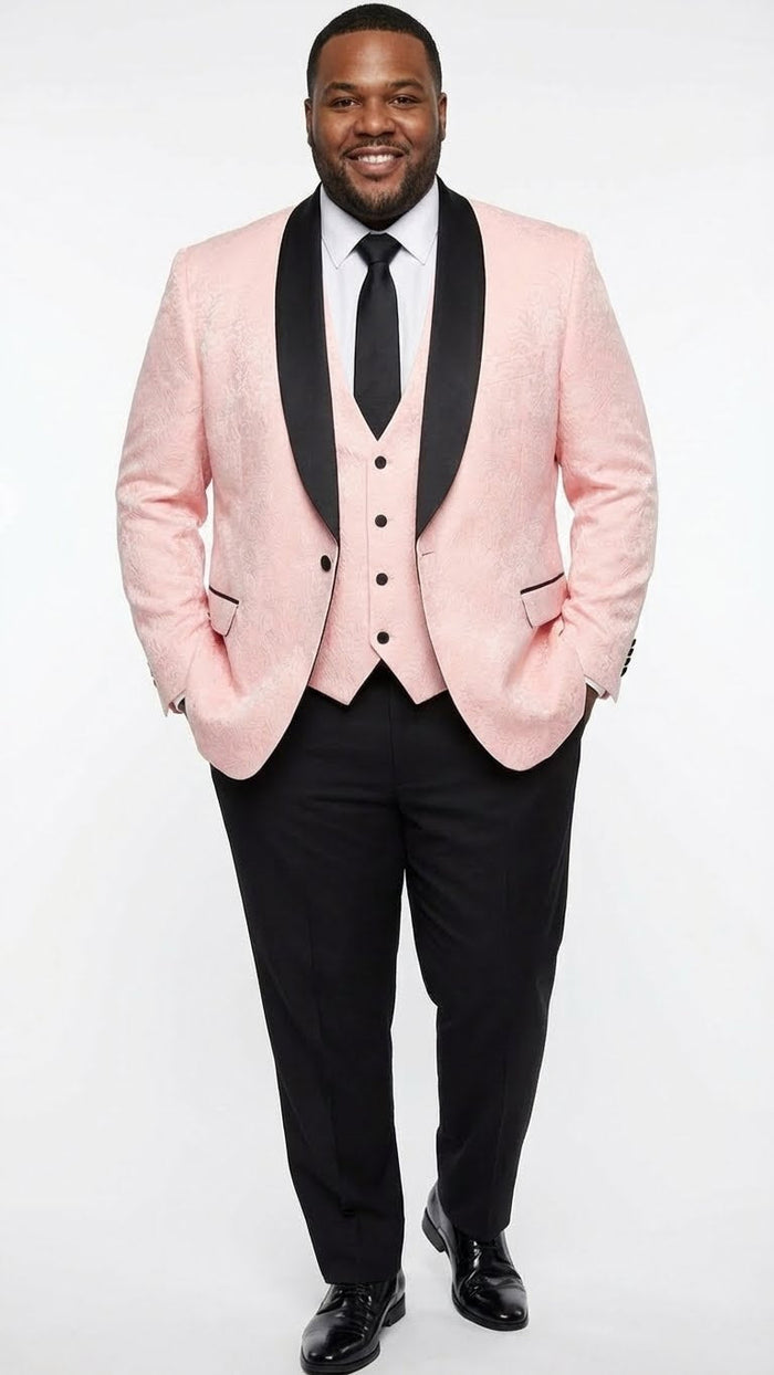 Men's blush pink tuxedo suit: textured jacket with black shawl lapel, matching vest, and black trousers. Jacket features front buttons and black pocket accents. Tailored silhouette.
