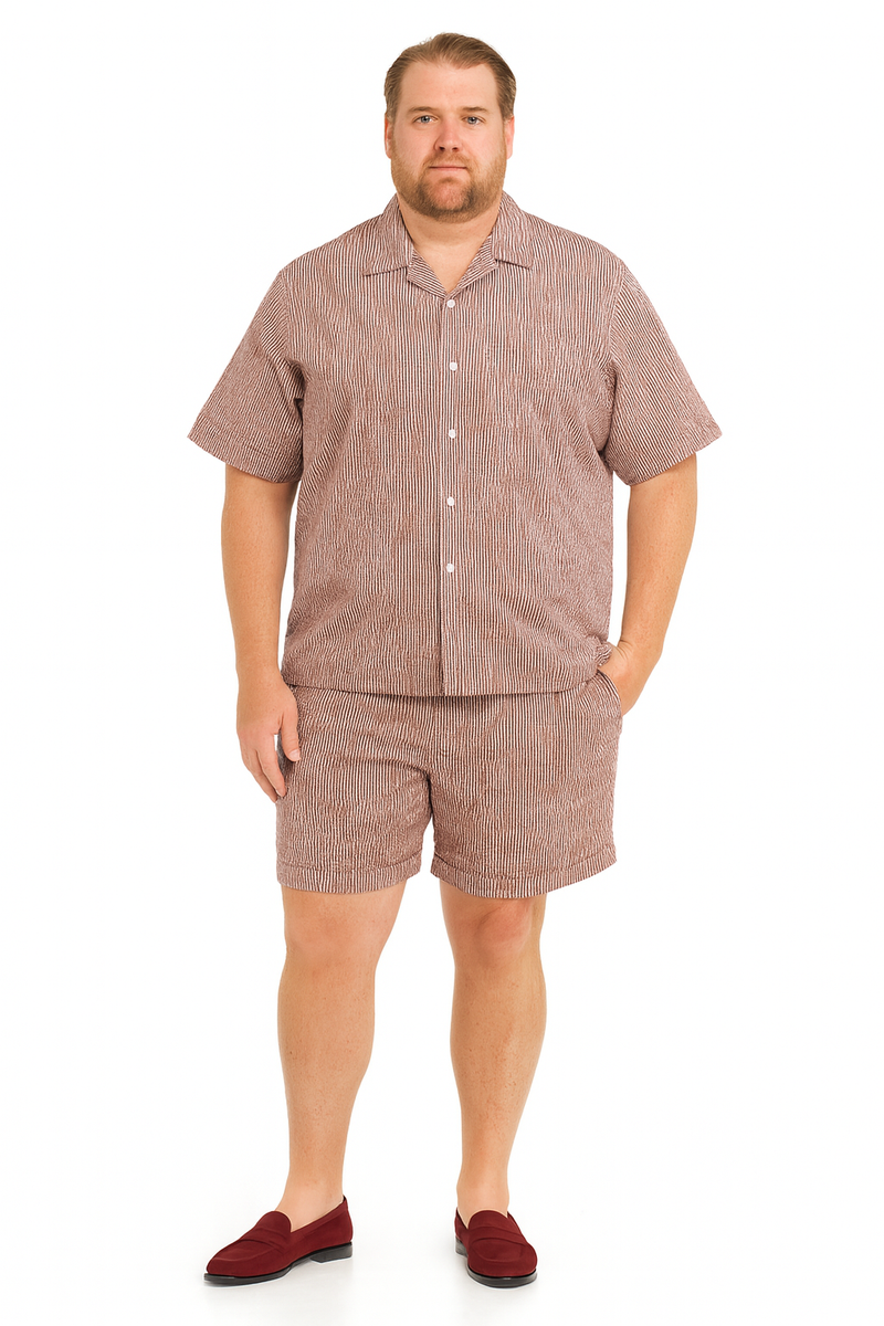 Men's burgundy seersucker short set: short-sleeved button-up shirt with notched collar & matching knee-length shorts. Striped burgundy & white pattern. Loose fit, lightweight fabric.
