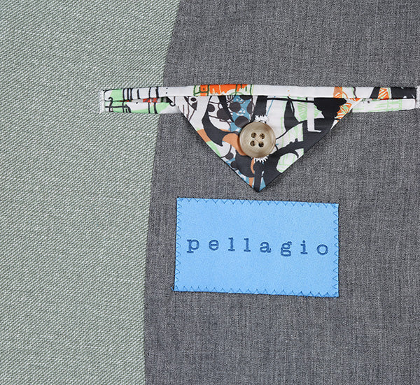 Pellagio light sage gray slim fit blazer. Half canvas, tailored silhouette. Decorative pocket flap with colorful pattern, button detail. "pellagio" brand label in blue.
