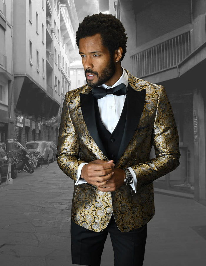Gold floral tuxedo with peak lapel, single-button closure, and a fitted silhouette. Includes a black bow tie and vest. Perfect for a formal, eye-catching look.
