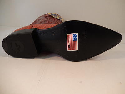 Cognac crocodile cowboy boots with a pointed toe and raised heel. Black base, American flag label, and crocodile skin texture with fine stitching on the upper.
