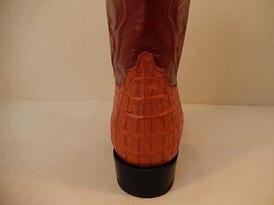 Cognac crocodile leather Wild West boots. Textured scales, tapered shaft, contrasting brown top. Stacked sole, slight heel.
