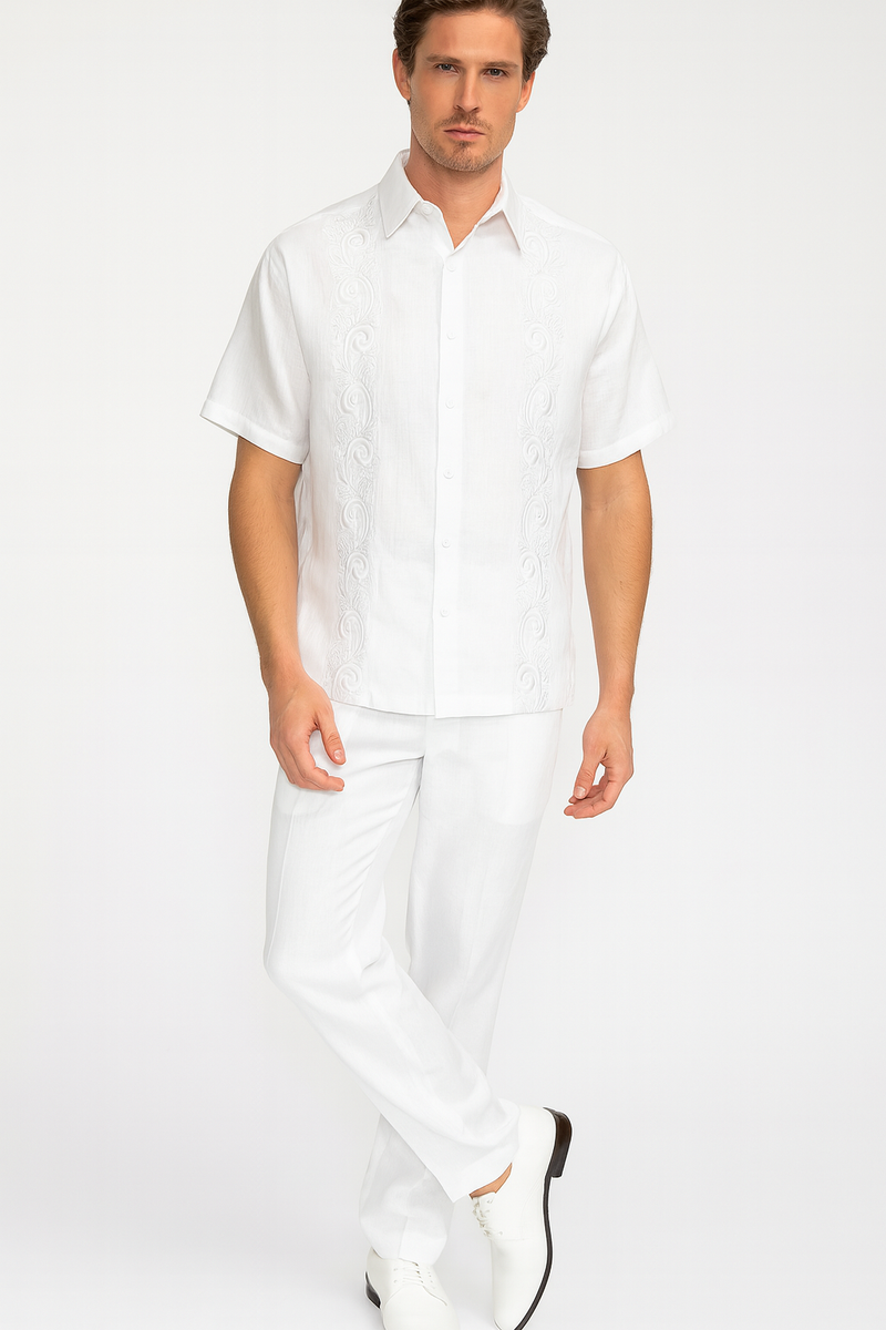 Men's white linen guayabera two-piece set. Short-sleeve embroidered shirt with button front & matching straight-leg pants. Lightweight & comfortable, perfect for warm weather. Clean, cohesive design.
