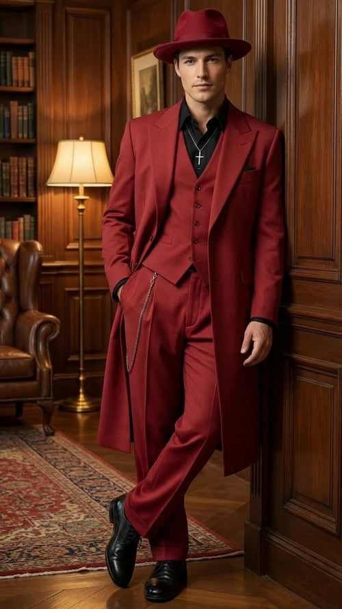 Alberto Nardoni men's 1920s red zoot suit. Tailored long coat, wide lapels, structured silhouette. Matching vest, loose trousers, tapered hem. Chain detail, wide-brimmed hat, black dress shoes.