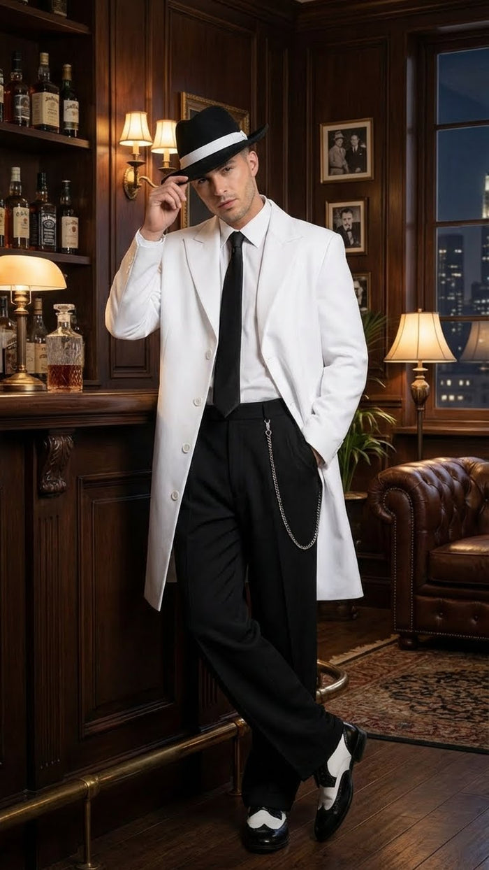 Men's white zoot suit gangster style outfit featuring a long white jacket, black trousers, and a black tie, constructed from fabric. The suit includes a side chain attachment and is complemented by two-tone shoes.