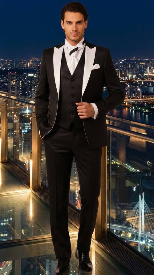 Men's black & white prom tuxedo: Black jacket with white satin lapels, black vest, & trousers. Tailored fit for structure. Includes white shirt & bow tie.
