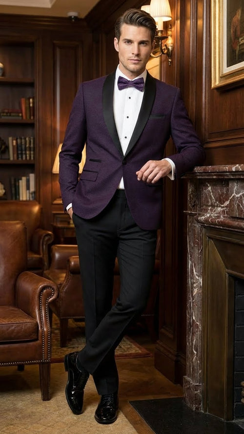 Eggplant purple men's tuxedo blazer with a fitted shape, black satin lapel, and two front pockets. Woven texture adds to its formal appeal.
