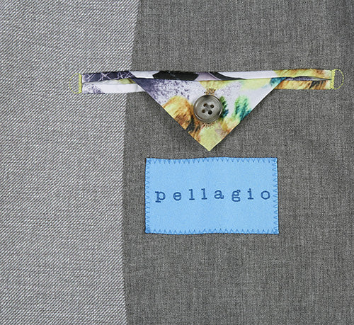 Pellagio's gray slim-fit blazer: half-canvas construction, subtle textured pattern, and a tailored shape. Details include a blue label and decorative pocket with a colorful triangular accent.

