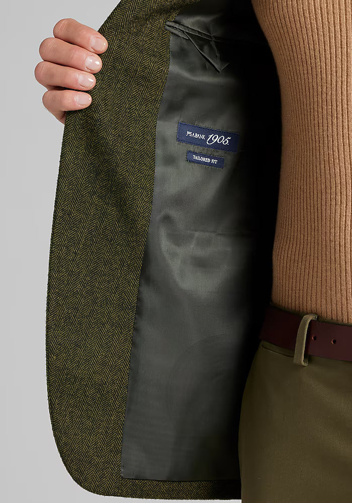 Olive green herringbone sportcoat. 1905 Tailored Fit. Solid gray lining. Structured lapels, defined silhouette.