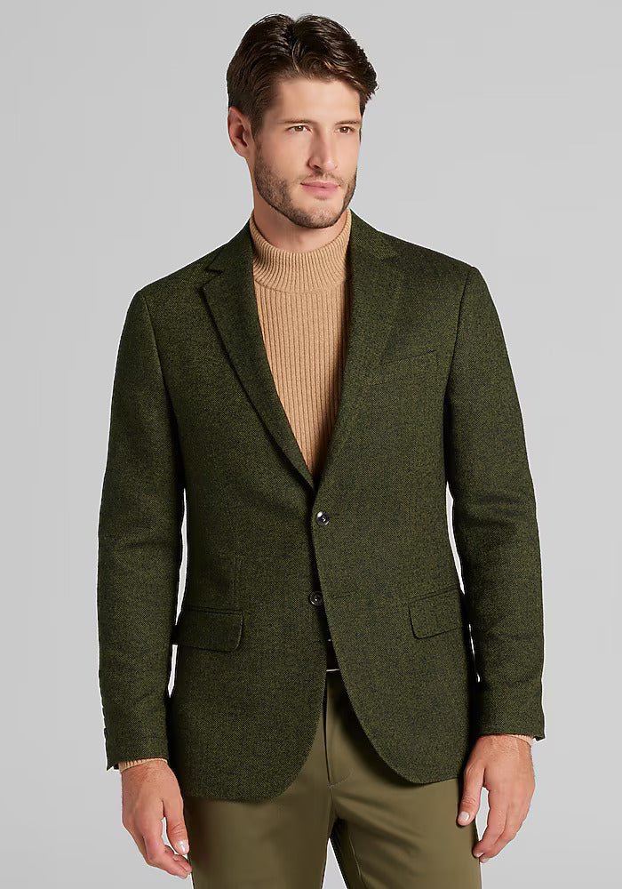 1905 tailored fit sportcoat in dark green herringbone. Notched lapel, 2-button closure, and two front pockets. Structured, fitted shape with long sleeves.