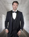Navy wool one-button shawl tuxedo. Tailored fit with satin lapels & pockets. Includes a double-breasted vest. Formal, cohesive ensemble for men.

