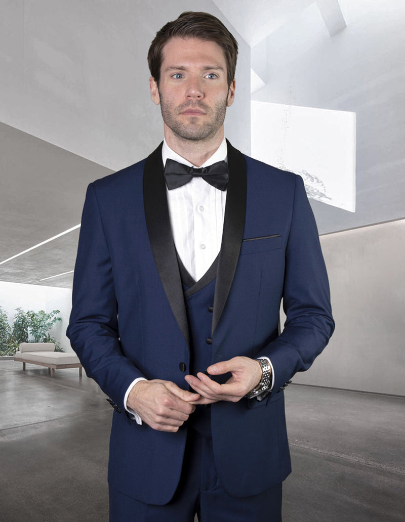 Navy wool tuxedo with a black satin shawl collar, matching double-breasted vest, and black bow tie. Features structured shoulders and tailored fit for a formal look.
