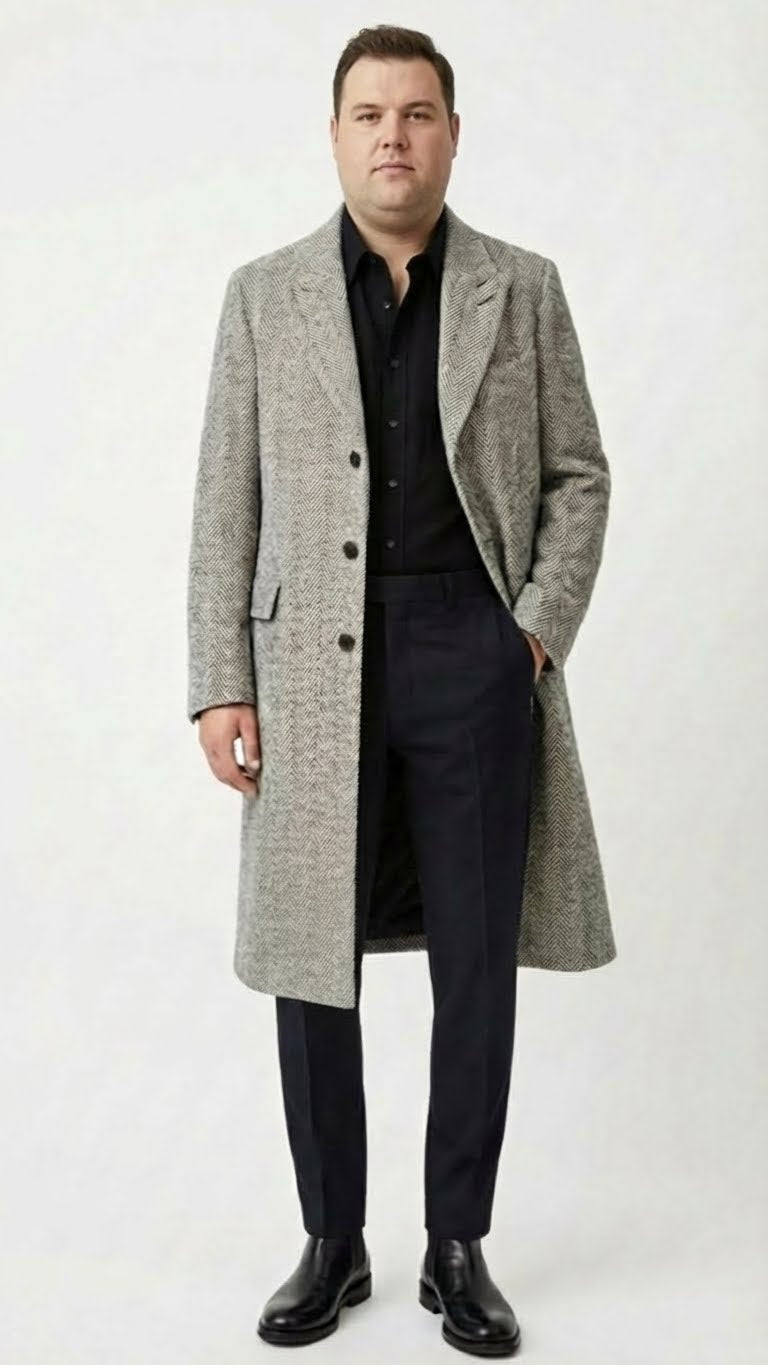 Alberto Nardoni men's grey herringbone overcoat. Classic tailored fit, textured grey fabric with a herringbone pattern. Single-breasted, three buttons, side pockets. Knee-length with a structured wide collar.

