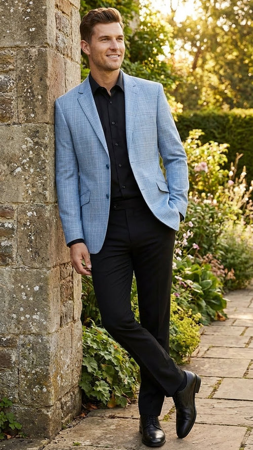 Men's big & tall light blue checkered blazer. Slim, tailored fit with single-breasted design, notched lapels, and two front pockets. Grid pattern on a light blue background. Dark buttons. Woven fabric.
