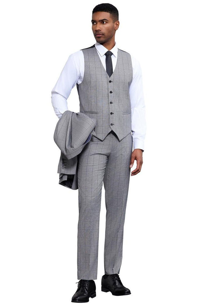 Stacy Adams light grey modern fit suit. Three-piece set: vested jacket, trousers, and suit jacket. Tonal windowpane plaid pattern. Straight-cut trousers. Includes vest with five buttons. Tailored, cohesive look.
