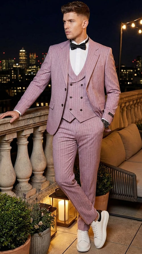 Men's dusty rose pink pinstripe three-piece suit. Slim-fit trousers, fitted vest, and jacket with notched lapels and double buttons. Subtle vertical pinstripes.
