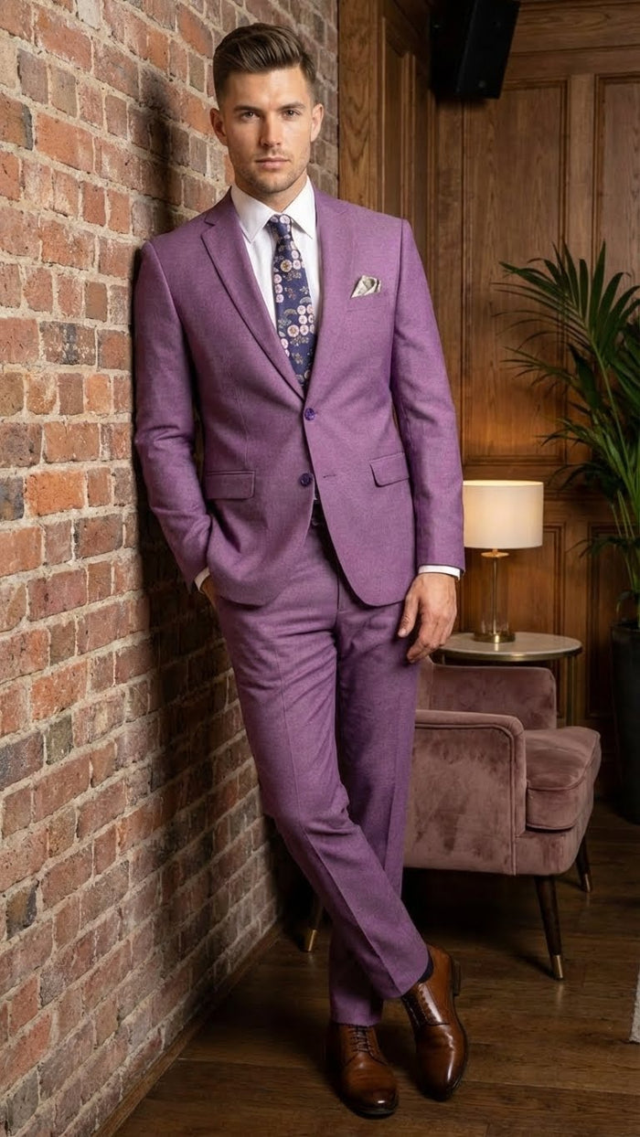 Men's light purple blazer. Structured design with 2-button closure, notch lapels, and side pockets. Smooth, textured fabric in a mauve hue. Tailored fit.