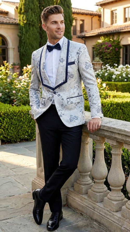 Men's floral jacquard blazer in white & navy. Features a contrast shawl lapel & tailored fit. Smooth jacquard fabric with floral patterns, pocket flaps, and button closures.
