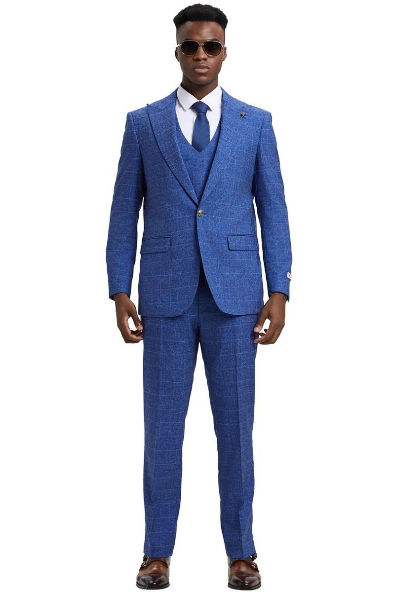 Men's Stacy Adams suit with blue windowpane plaid. Includes a double-breasted vest, structured jacket with gold buttons, and complementing trousers. Textured fabric in blue shades.
