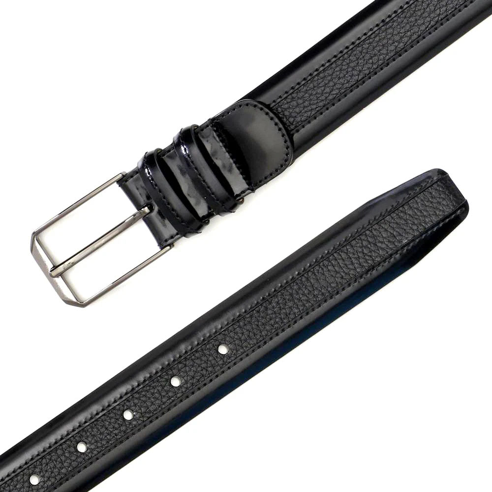 Black Mezlan deerskin belt with smooth finish and textured strap. Metal, four-prong buckle. Three keeper loops. Five size adjustment holes. Stitched edges for durability.
