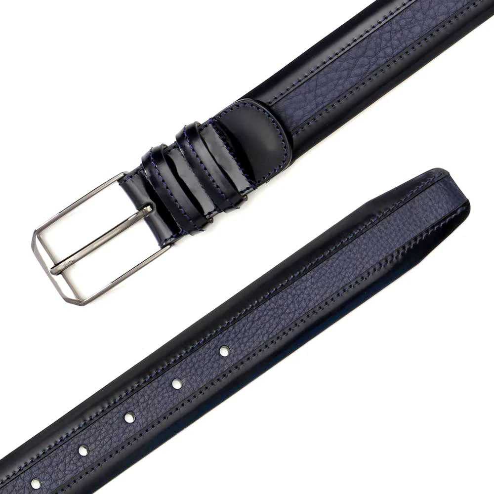 Mezlan blue deerskin belt. Smooth, textured leather with standard width. Features adjustable holes and a silver-tone metal buckle.
