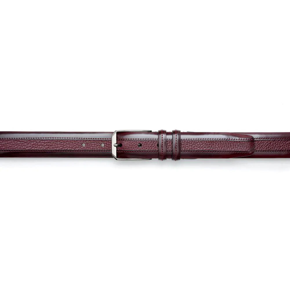Burgundy Mezlan deerskin belt with smooth texture and visible stitching. Straight form, silver buckle. Adjustable with evenly spaced holes and a keeper.
