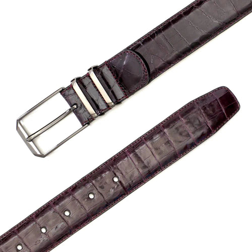 Burgundy Mezlan crocodile belt with textured skin pattern. Rectangular metal buckle. Adjustable with multiple holes. Stitched edges for a finished look.
