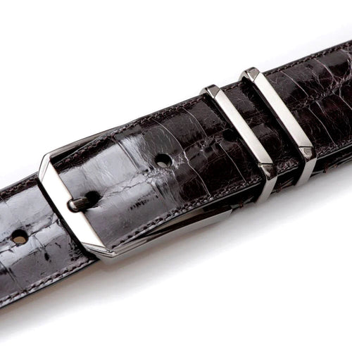 Textured, shiny brown Mezlan belt crafted from crocodile-patterned leather. Features a dual-prong metal buckle and adjustable fit with multiple holes.
