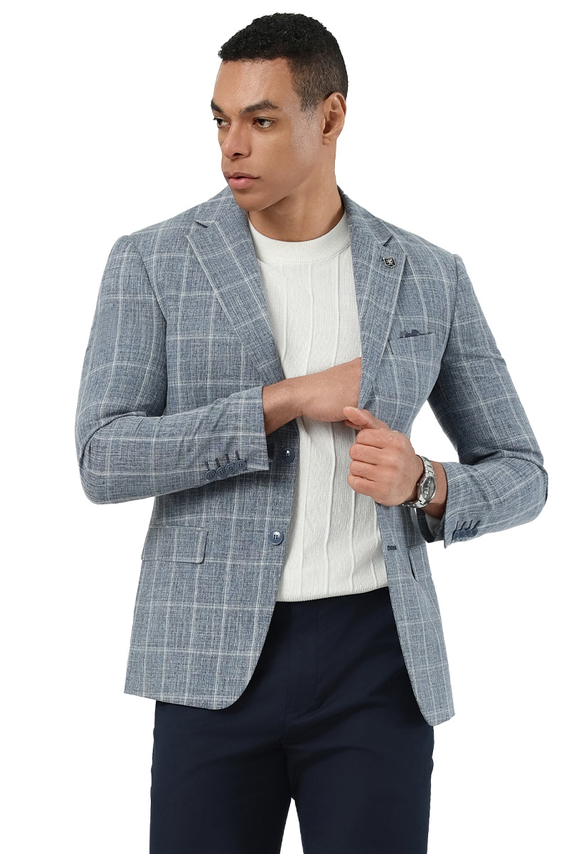 Light blue Stacy Adams men's modern fit blazer. Fitted shape, notch lapel, two-button closure. Lightweight fabric with white windowpane plaid. Features front pockets, chest pocket, and buttoned cuffs.
