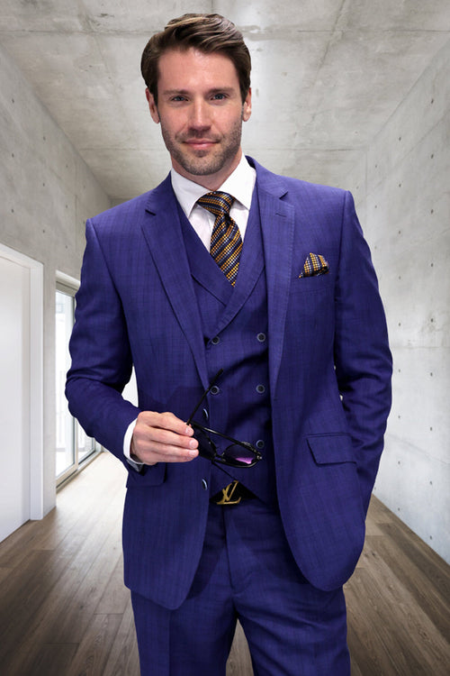 Sapphire blue men's wool suit. Three-piece design: windowpane plaid blazer (notch lapel), vest, and trousers. Textured fabric. Blazer: front & breast pockets. Vest: button closure. Trousers: fitted.
