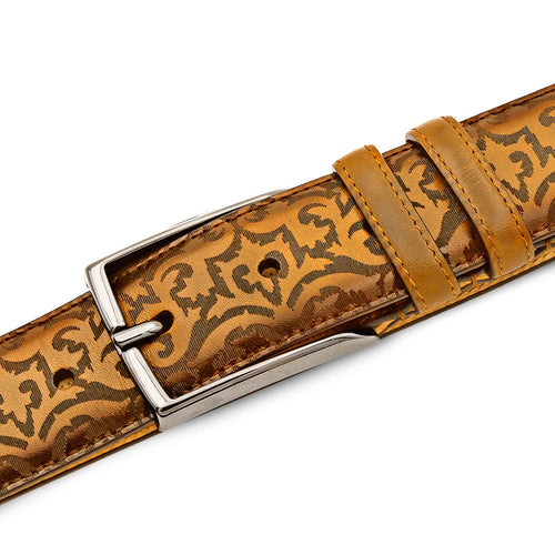 Mezlan camel calfskin belt. Laser-printed patterned surface with brown abstract design. Silver-tone buckle and leather keepers. Smooth finish.

