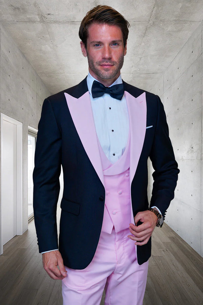 Black wool tuxedo with pink satin lapels and vest. Includes a white shirt, black bow tie, and pink pants. Stylish and bold.
