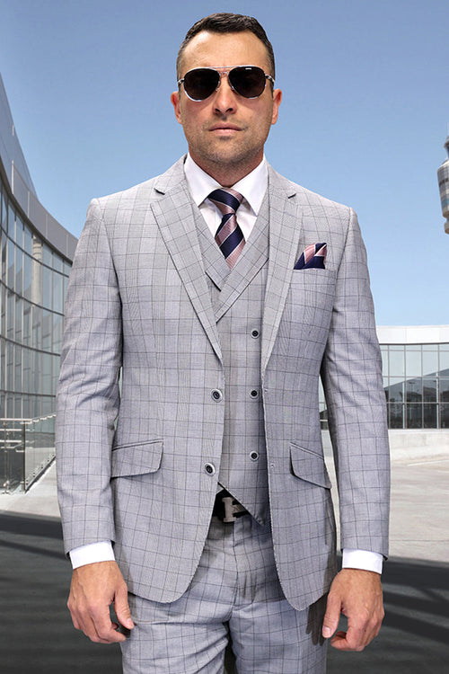 Modern fit black wool suit with windowpane plaid. Sharp lapels, buttoned vest, and matching pattern. Black and grey color scheme. Includes jacket with front pockets. A stylish, fitted design.
