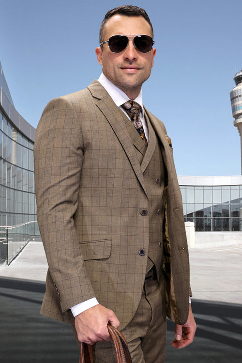 Bronze wool suit with windowpane plaid. Modern fit, two-button blazer, vest, and trousers. Woven wool fabric. Notch lapels, side pockets. Structured silhouette.
