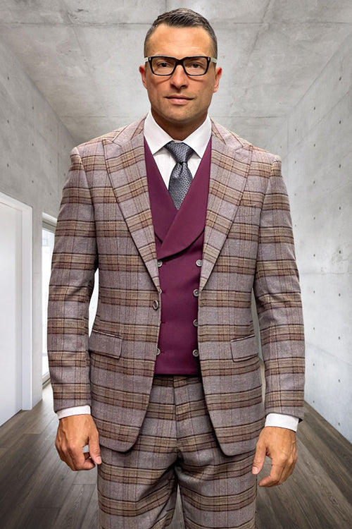Men's burgundy wool suit with windowpane plaid. Features a one-button peak lapel jacket, vest, and matching pants. Tailored fit, textured fabric, and flap pockets.
