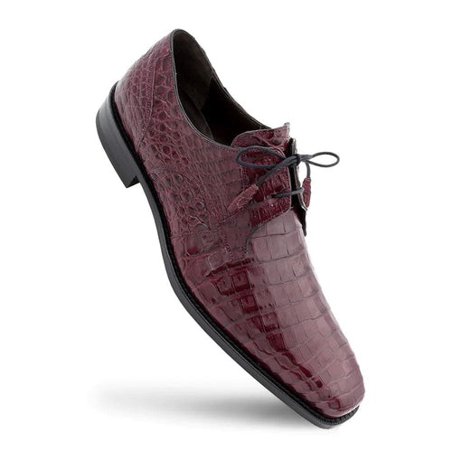 Anderson Burgundy crocodile lace-up shoes. Elongated shape, pointed toe, low black rubber sole. Deep burgundy crocodile skin upper. Features black laces and dark interior.
