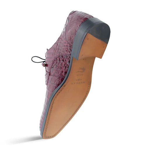 Mezlan's Anderson: burgundy genuine crocodile lace-up. Structured design, rounded toe. Textured surface, slightly elevated heel with rubber base. Tan sole, distinct color separation.
