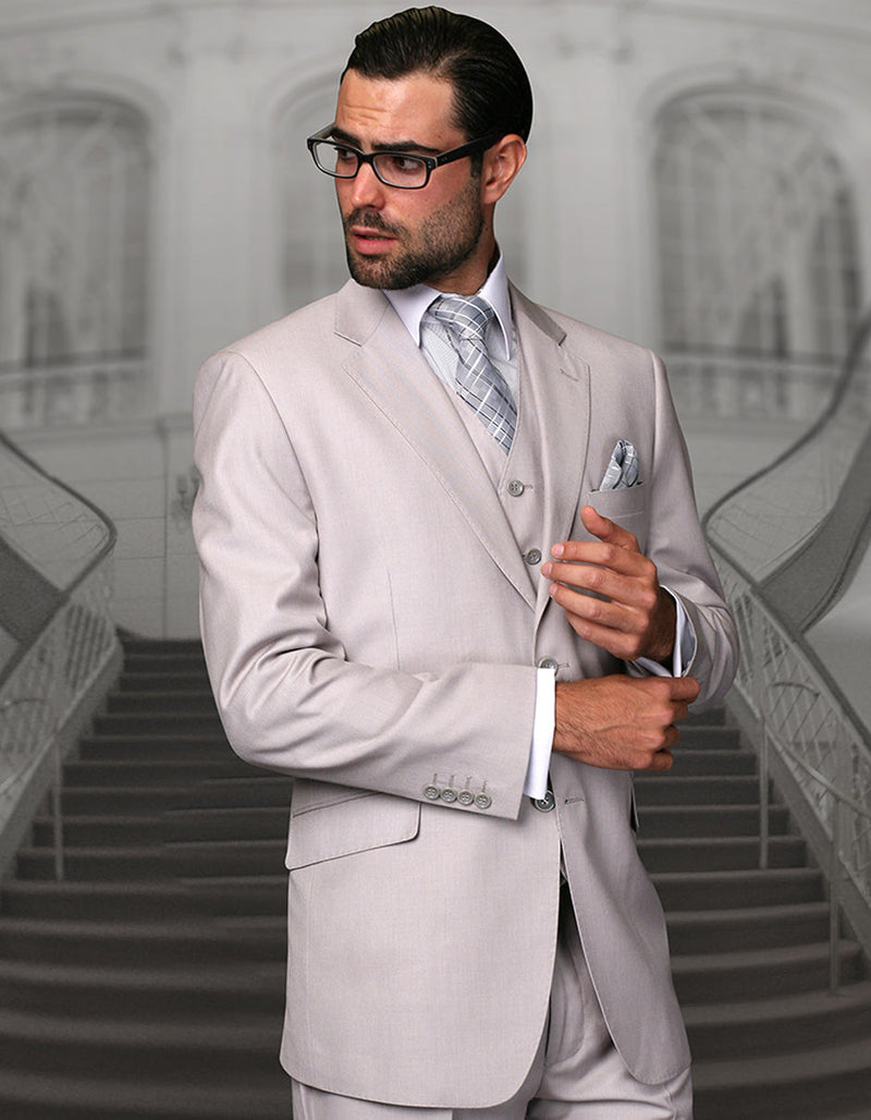 Ash grey men's wool suit with a modern fit. Two-button closure, single-breasted, slim silhouette. Includes matching vest, notch lapel, buttoned cuffs, and side pockets. Ideal for formal events.
