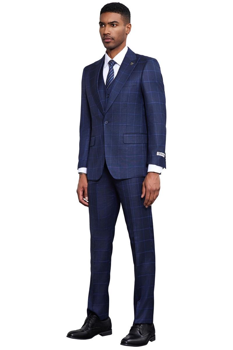 Navy blue Stacy Adams suit: classic one-button, vested, windowpane pattern. Tailored blazer with peak lapels, slim-fit trousers. Lightweight, structured design.
