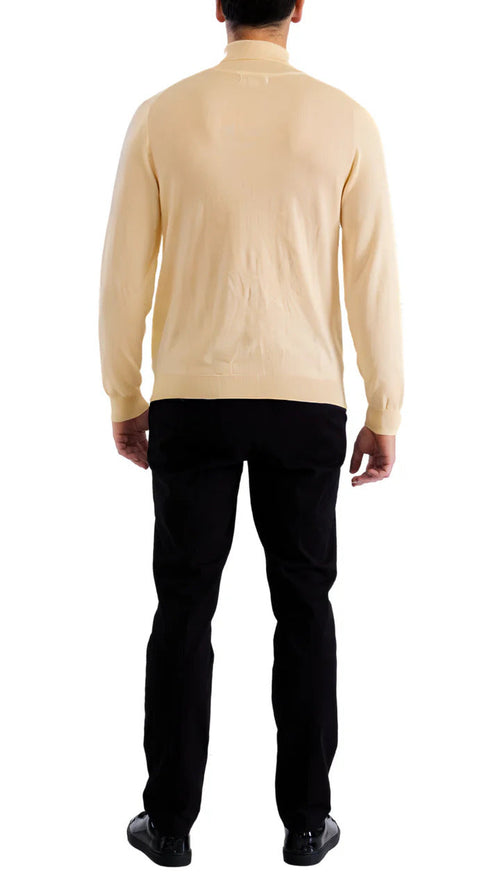 Beige men's turtleneck sweater with long sleeves and a form-fitting silhouette. Smooth, potentially knit fabric. Provides neck coverage. Neutral background highlights the sweater.
