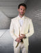 Ivory men's paisley tuxedo. Single-button, peak lapel design. Includes matching vest and trousers.
