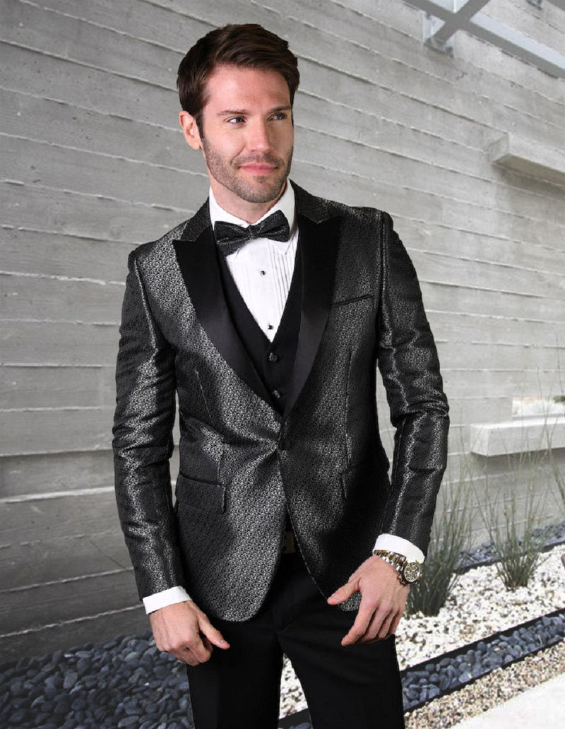 Black men's tuxedo with peak lapels and a subtle shiny pattern. Fitted design includes a vest, long sleeves, and pockets. Completed with a white dress shirt and bow tie.
