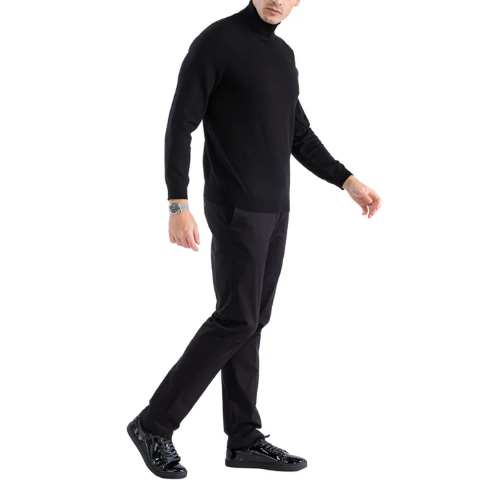 Men's black fitted turtleneck sweater. Soft, flexible knit fabric with long sleeves. Turtleneck design. Solid black color, no patterns or logos.
