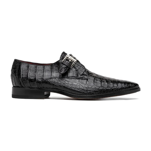 Genuine black caiman crocodile dress loafers. Single monk strap, pointed toe, silver buckle. Textured scale pattern. Low square heel.
