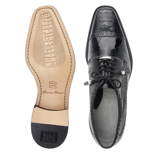 Black ostrich leather men's Belvedere dress shoe with cap toe. Pointed toe, lace-up closure, and contrasting leather/rubber sole. Features embossed logo on the bottom.
