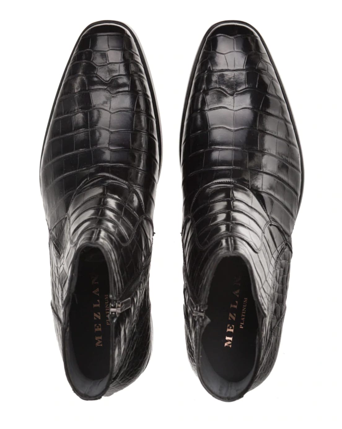 Mezlan's Belucci Black boot: Genuine alligator skin upper with a textured pattern. Sleek, pointed-toe silhouette. Side zipper for easy entry. Smooth finish, structured design.
