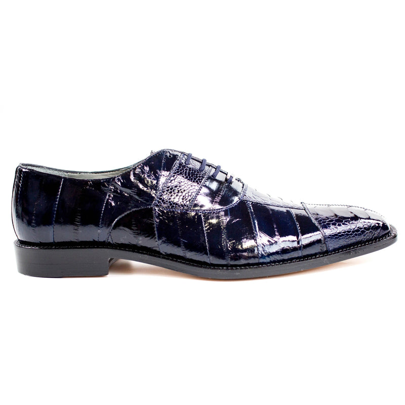 Men's Belvedere Mare dress shoe: glossy tan eel leather, narrow profile, pointed toe. Features five-eyelet lace-up, black rubber sole for traction, and a slightly raised heel. Formal design.
