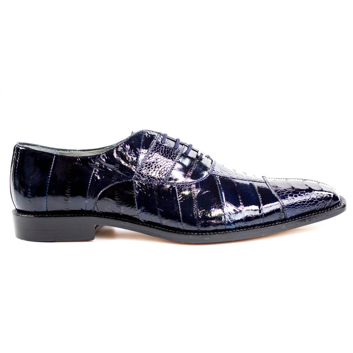 Men's Belvedere Mare dress shoe: glossy tan eel leather, narrow profile, pointed toe. Features five-eyelet lace-up, black rubber sole for traction, and a slightly raised heel. Formal design.
